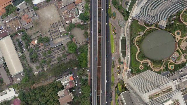 Top Down Aerial Aerial drone  view of Jakarta city skyscrapers during the afternoon under cloudy day. Wide shot on 4K DJI Mavic 2