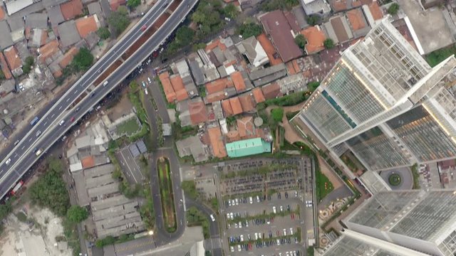 Top Down Aerial Aerial drone  view of Jakarta city skyscrapers during the afternoon under cloudy day. Wide shot on 4K DJI Mavic 2