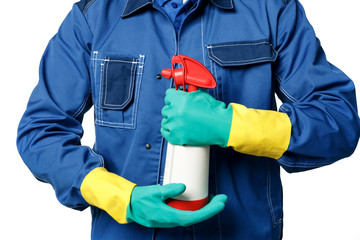 Men's hands in rubber gloves and a janitor's uniform hold chemical spray bottle for cleaning.