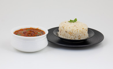 Rajma Chawal or Rajma Jeera Chawal (Rice) is a Traditional North Indian Food, Consisting of Cooked Red Kidney Beans in a Thick Gravy with Spices. Served with Jeera Rice