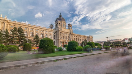 Naklejka premium Beautiful view of famous Naturhistorisches Museum (Natural History Museum) with park and sculpture timelapse hyperlapse in Vienna, Austria. Warm light at evening