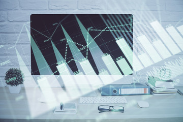 Forex graph hologram on table with computer background. Double exposure. Concept of financial markets.