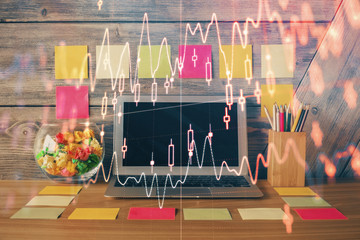 Multi exposure of chart and financial info and work space with computer background. Concept of international online trading.