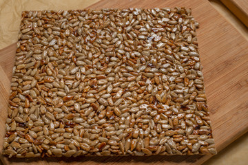  This is a dessert of honey syrup and sunflower seeds.