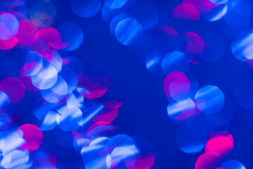 Dark blue background with light effects and white and pink lens flares