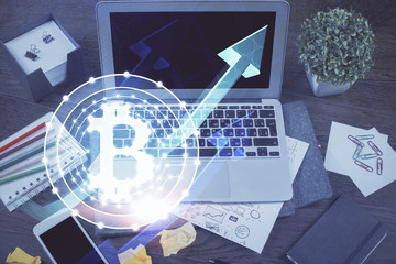 Double exposure of blockchain theme hologram and table with computer background. Concept of bitcoin...