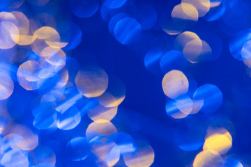 Dark blue background with light effects and white and yellow lens flares