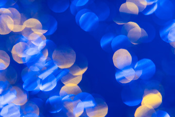 Dark blue background with light effects and white and yellow lens flares