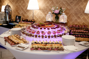 Dessert table, coffee, tea at a wedding party