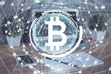 Double exposure of blockchain theme hologram and table with computer background. Concept of bitcoin...