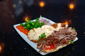 close up of kebab sandwich on wooden background