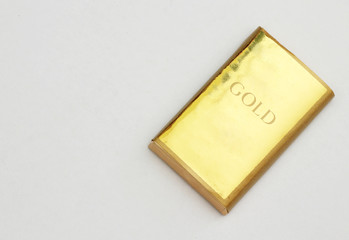 Gold bar isolated on white background.