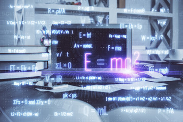 Desktop computer background and formula hologram writing. Double exposure. Education concept.