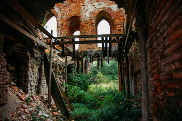 Old abandoned overgrown medieval castle ruins