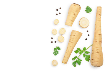 Parsnip root and slices with parsley peppercorns isolated on white background with copy space for your text. Top view. Flat lay,