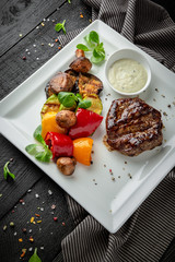 Juicy delicious Beef steak with vegetables and asparagus. Restaurant menu.