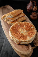 Homemade pies with cottage cheese, potatoes, or minced meat. Filled puff pastry
