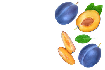 fresh blue plum and half with leaves isolated on white background with copy space for your text. Top view. Flat lay