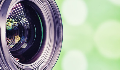 Equipment videographer and photographer. Lenses on the table against the background of bright...