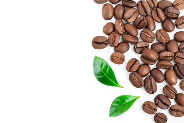 Heap of roasted coffee beans with leaves isolated on white background with copy space for your...