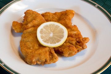 Viennese Schnitzel on an Elegant Plate with Lemon Wheel