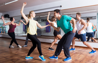 Fototapeta na wymiar People learning swing at dance class