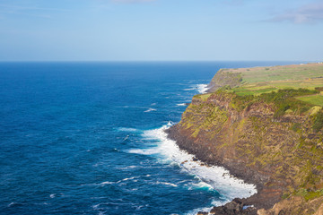 Fototapeta na wymiar Cliffs and Atlantic ocean view from the observation deck Vigia das Baleias, Terceira.