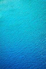 Obraz na płótnie Canvas Sea surface aerial view. Background image of the turquoise sea. Deep sea and corals. Aerial drone shot of turquoise water, space for text. Aquamarine background. Sea Aerial view.