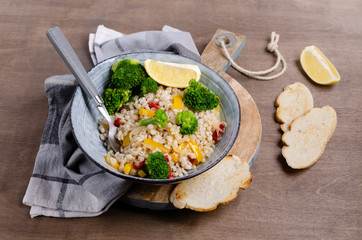 Warm pearl salad with vegetables