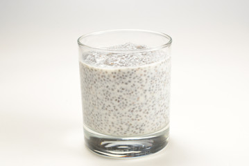 Chia pudding  in glass on a white background. Space for text or design.