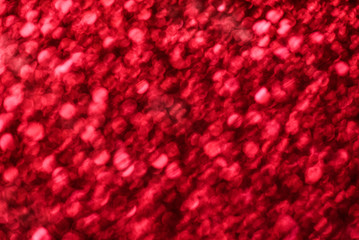 Abstract deep red glitter texture sparkle background.