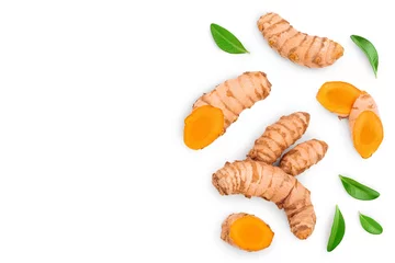 Fotobehang turmeric root and slices isolated on white background with copy space for your text. Top view. Flat lay © kolesnikovserg