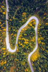 Curved bending road in the forest. Aerial image of a road. Forrest pattern. Scenic curvy road seen...