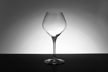 empty wineglass on black and white  background