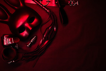 Leather whip, handcuffs, choker, mask and metal anal plug for BDSM sex with submission and...