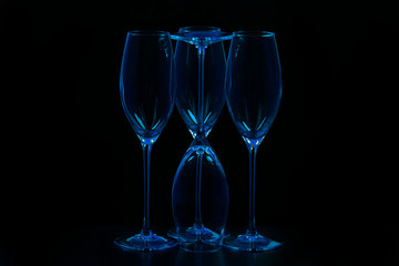 empty blue wine glasses on black  background