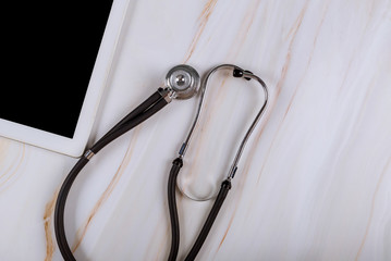 Medical Stethoscope digital tablet on wooden desk