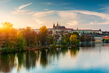 Prague autumn landscape. Prague autumn landscape view to Saint Vitus cathedral. Prague. Prague panorama. Prague, Czech Republic. Scenic autumn aerial view of the Old Town with red foliage. Czechia.