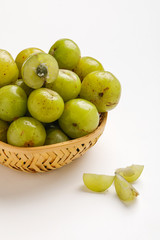 Fresh Indian gooseberry in wooden  bowl 