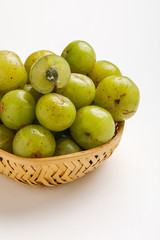 Fresh Indian gooseberry in wooden  bowl 