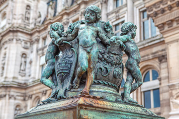 statues of bronze naked children