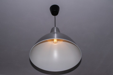 gray loft chandelier on a uniform background