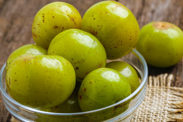 Fresh Indian gooseberry in glass bowl 
