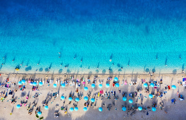 Croatia. Aerial view on the beach with umbrellas. Beach and azure water. Summer background. Travel and relax - image