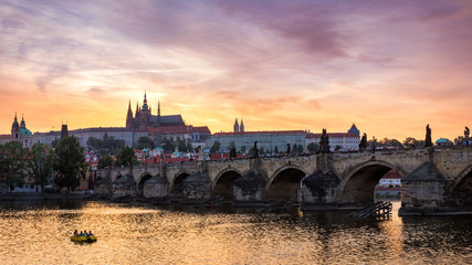 Charles Bridge at sunset with colorful sky, Prague, Czech Republic. Prague old town and iconic...