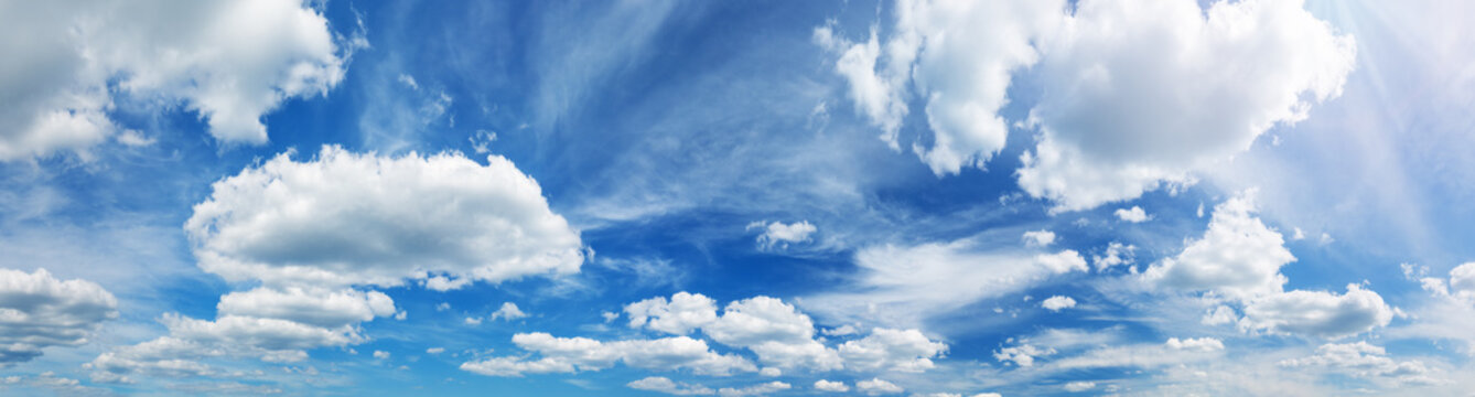 white fluffy clouds on blue sky in summer © candy1812