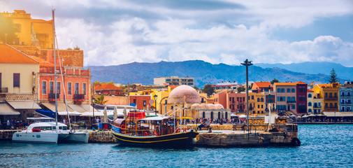 Fototapeta na wymiar Picturesque old port of Chania. Landmarks of Crete island. Greece. Bay of Chania at sunny summer day, Crete Greece. View of the old port of Chania, Crete, Greece. The port of chania, or Hania.