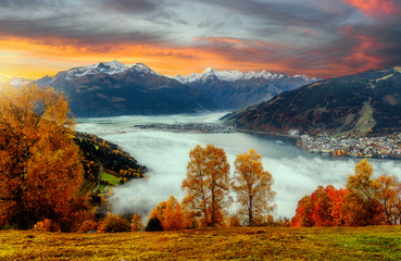 Impressively beautiful Fairy-tale mountain lake in Austrian Alps. Beautiful mountain landscape in the Alps with Zeller Lake in Zell am See, Salzburger Land, Austria. Fantastic Autumn Scene at sunset
