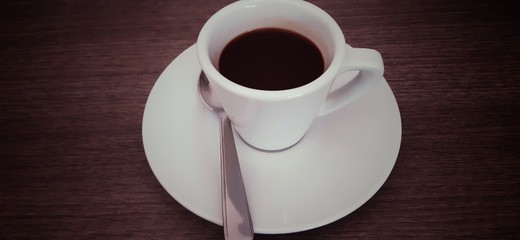 cup of coffee and cookies on wooden table