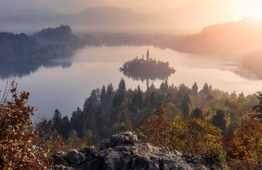 Fantastic Misty morning over the Fairy tale mountain lake. Amazing View On Bled Lake during sunrise. Wonderful nature scene. Adventures and travel concept. Awesome spring landscape. Slovenia.